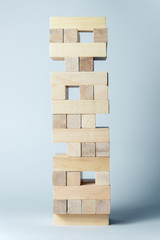The tower of wooden cubes, as a symbol of support, teamwork and business development. Horizontal frame