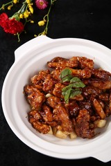 pork with rice and vegetables on white plate