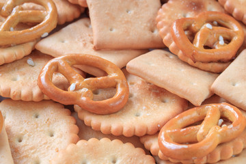 Cracker of different shapes close-up view from above as background