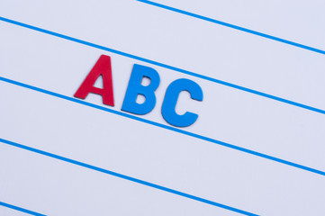 English alphabet made of plastic letters on a magnetic board