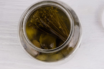 Pickled cucumbers with herbs and spices