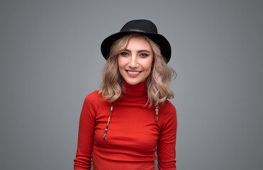 Cheerful woman in black hat