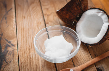 Close-up of coconut oil on wooden board 