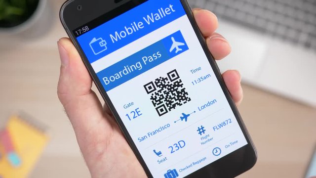 Airplane boarding pass being showed on a smartphone mobile phone screen