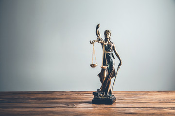 justice lady  on the wooden table