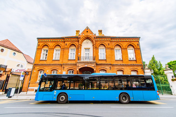 city bus station with blue bus