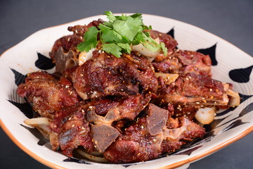 grilled meat with vegetables on white plate