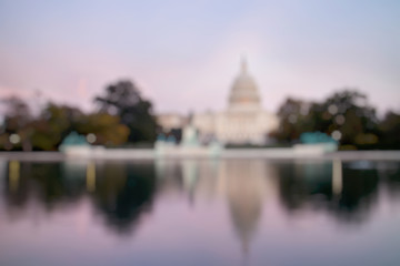 Out of Focus of The United States Capitol Building, seen from reflection pool on dusk. Washington...