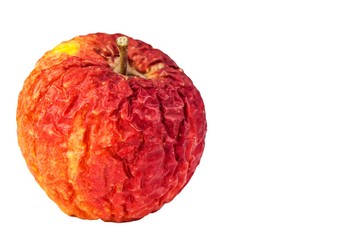 Wrinkled apple texture with white background. Shriveled apple. Old apple. Isolated on white.