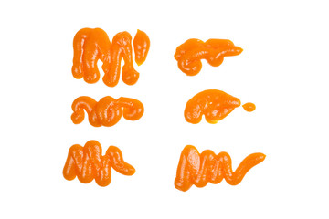 Orange sauce splashes isolated on white background
