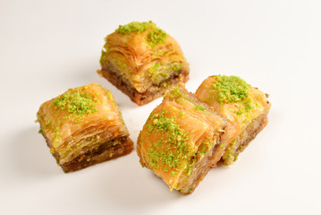 Pistachio baklava on a white background. Dessert.