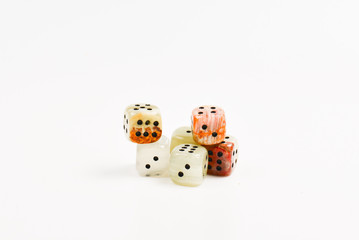 Dices made of natural stone on a white background. Copy space. Gaming.
