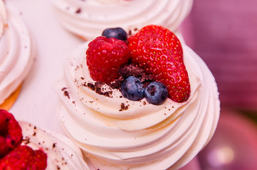 berries topping a delicious cake close up