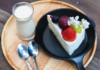 Sweet fruit cream cake cut serve.