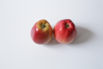 red apples on white background with copy space for text. Flat lay. Top view.