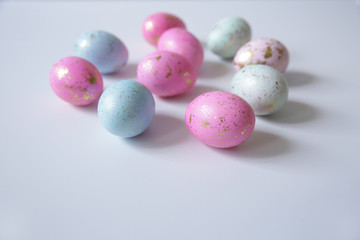 Colorful easter eggs on light blu background. Easter. With copy space for text.