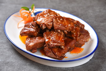 fried chicken with sauce on white plate