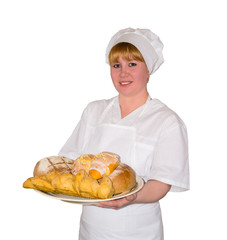 woman baker holds a dish with sweet buns isolated