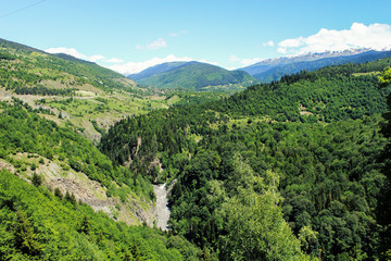 Dangerous mountain road in the middle of the valley in the caucasus Georgia