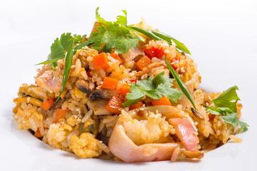 seafood risotto with sesame in a white plate