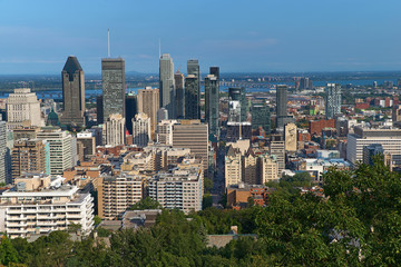 Fototapeta premium Montreal, Quebec, Canada, September 01, 2018: view of the city of Montreal in Quebec, from the Chalet du Mont Royal Mount Royal Kondiaronk belvedere viewpoint. the central business district.