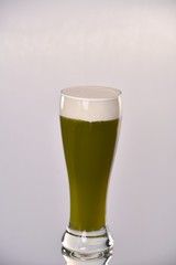 glass of beer with foam isolated on white