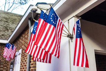 Old American flags with a ring on the building