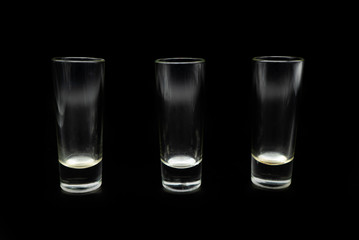 glass of whiskey on black background