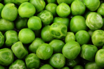 Fresh green peas background texture top view.Full depth focus.