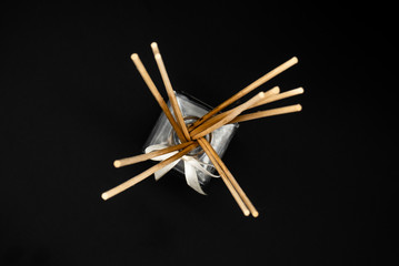 chopsticks on black background