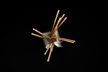chopsticks on black background