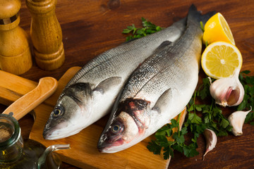Two raw sea bass fish