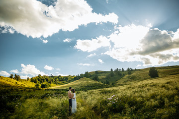 Love Couple in love romantic road summer field happy. Russia. lake aslykul