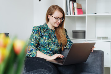 Attractive young woman working from home
