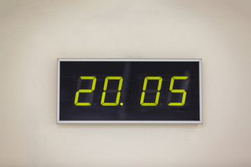 Black digital clock on a white background showing time 20.05