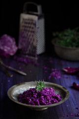 Obraz na płótnie Canvas Served purple cabbage salad on textured background