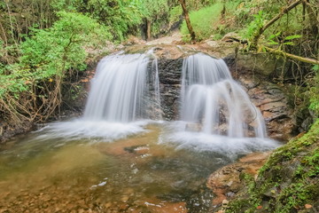 Mae Pan Waterfall, view of silky water flowing around with green forest background, Doi Inthanon, Chiang Mai, northern of Thailand.