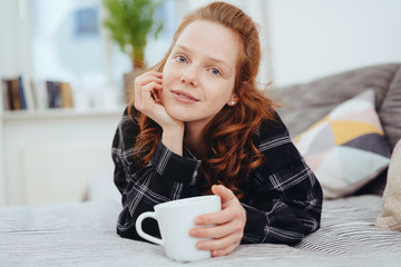 Quiet serious young woman looking at camera