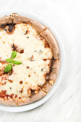 Homemade pizza on white plate