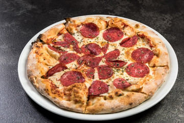 Stone baked pizza cut in slices