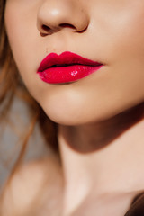 selective focus of sensual young woman with red lips