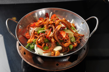 chicken with vegetables in a frying pan