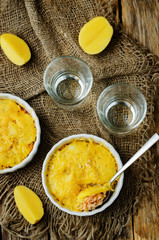 Salmon potato casserole with glasses of water