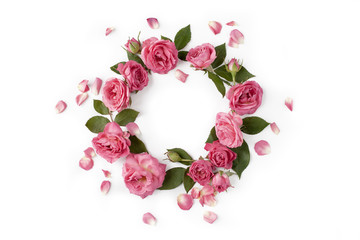 Floral round wreath. Flowers composition made of roses, leaves and petals isolated on white background.