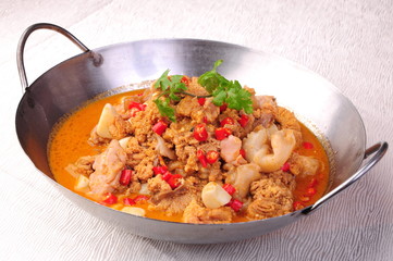 beef stew with vegetables and rice in bowl