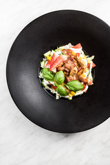 Fresh salad.Concept for a tasty and healthy meal. White stone background.