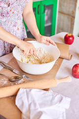 woman mixing ingredients and preparing dough for homemade cake