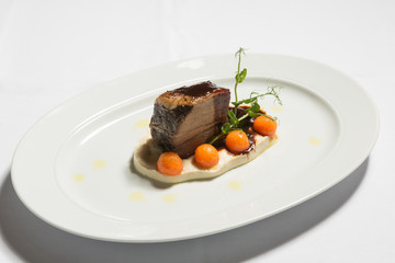 Slow cooked beef in wine with tomato puree