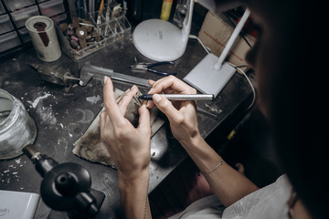 The master jeweler applies markup to the jewelry