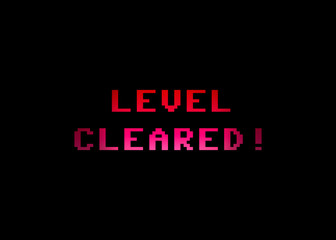 A videogame screen with the text Level cleared. 8 bit retro style.